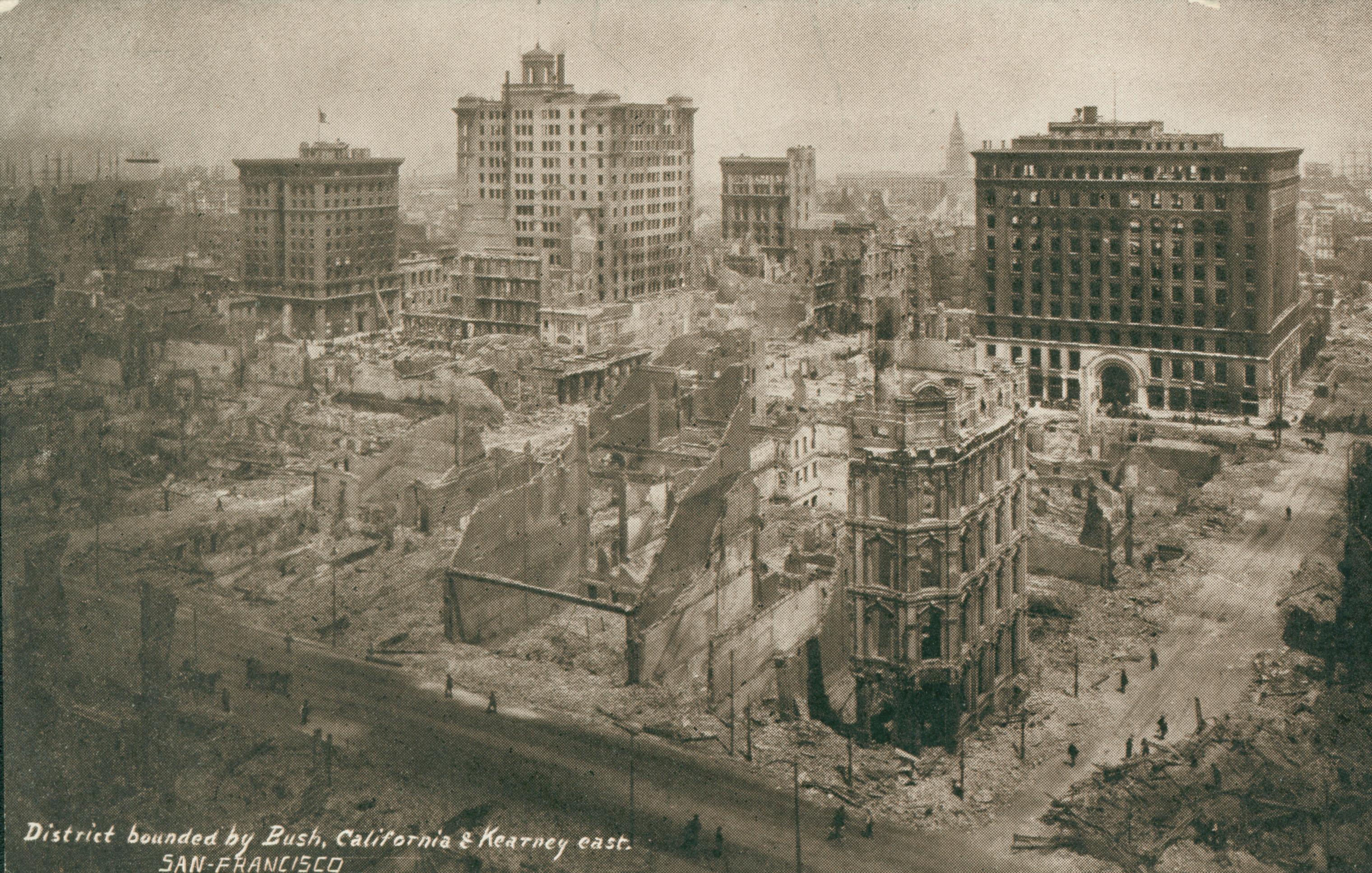Shows a bird's-eye view of several blocks of destruction.