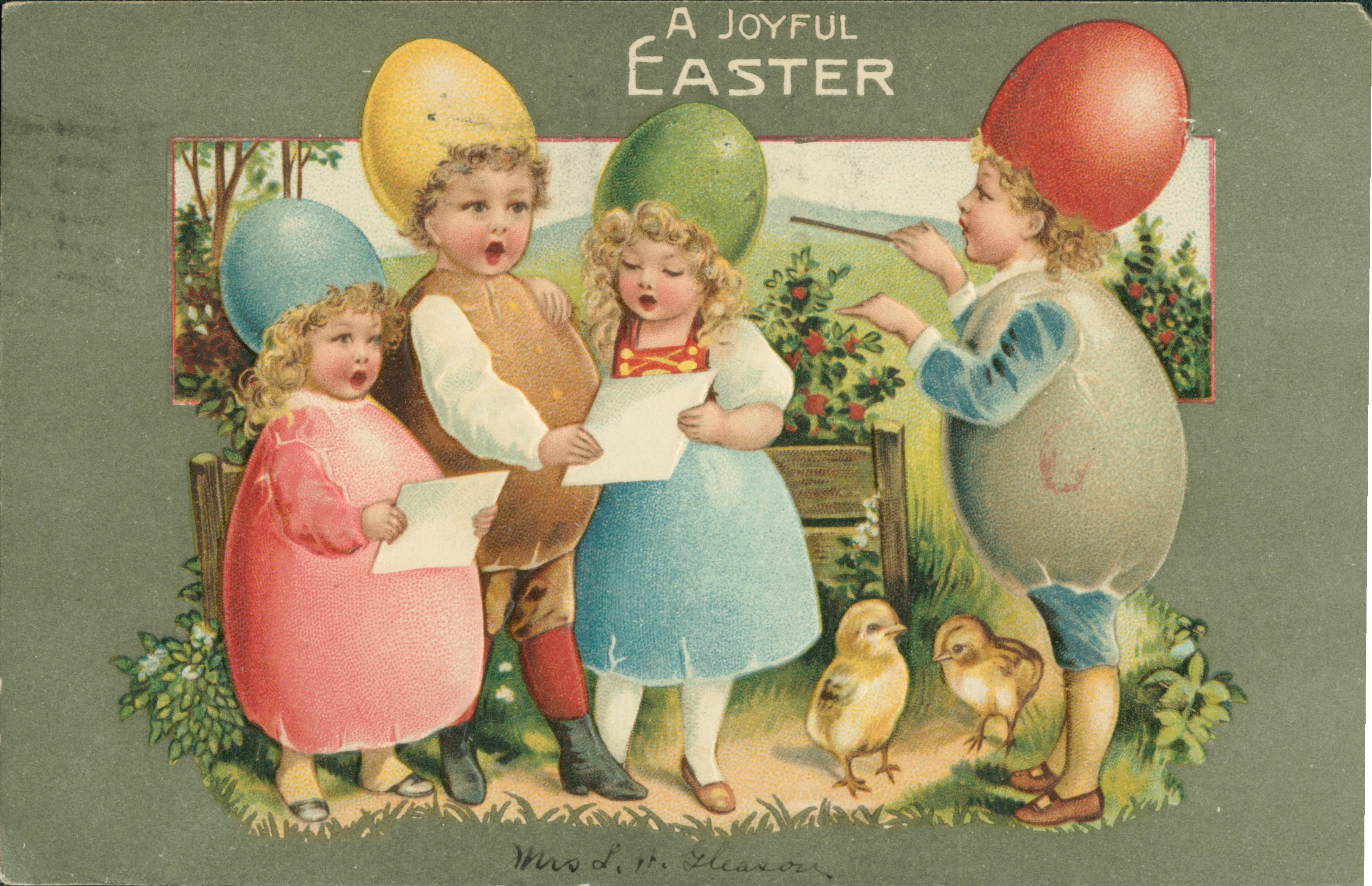 A group of four children dressed as colored eggs singing a song.