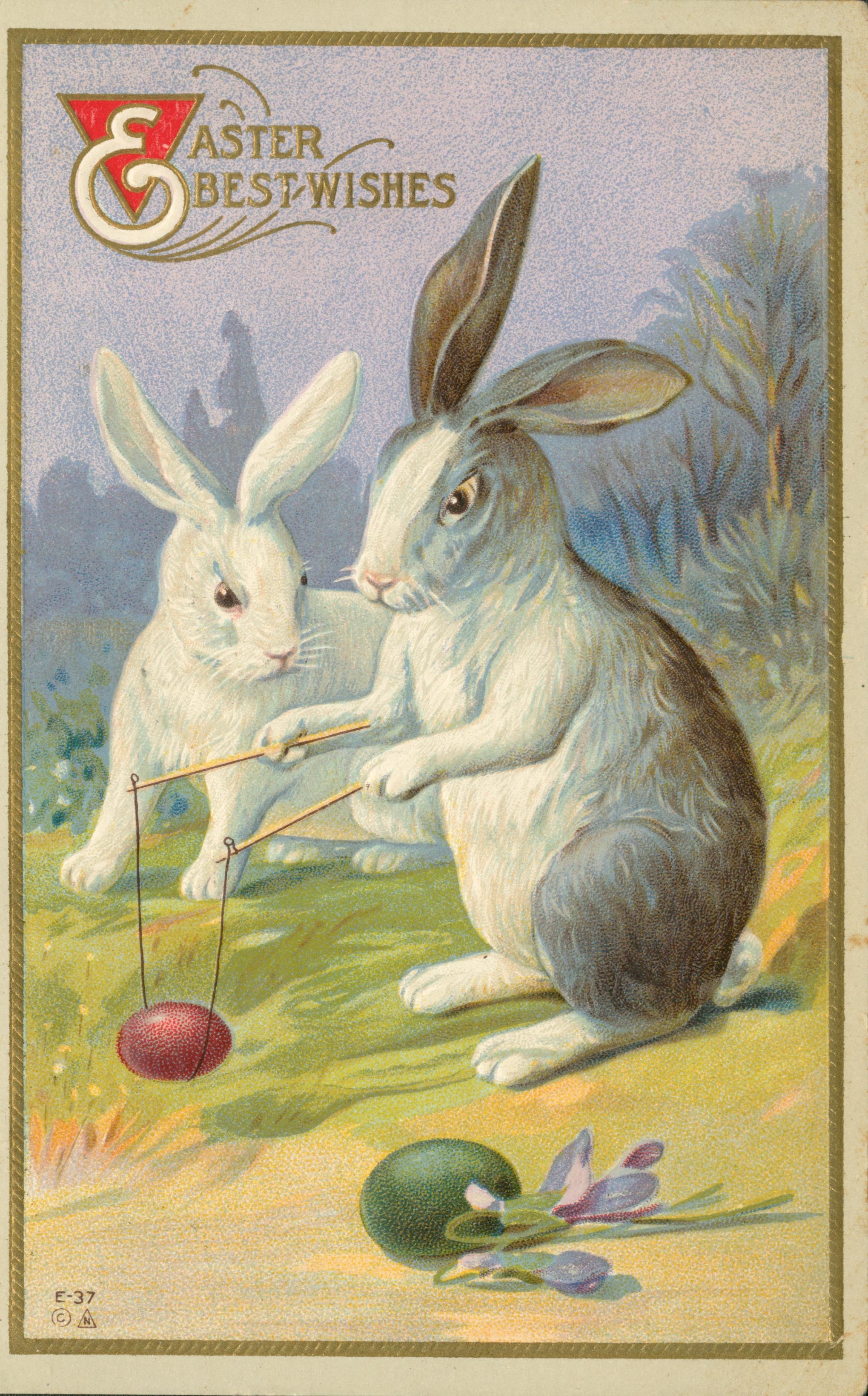 Two rabbits playing a game with an egg.