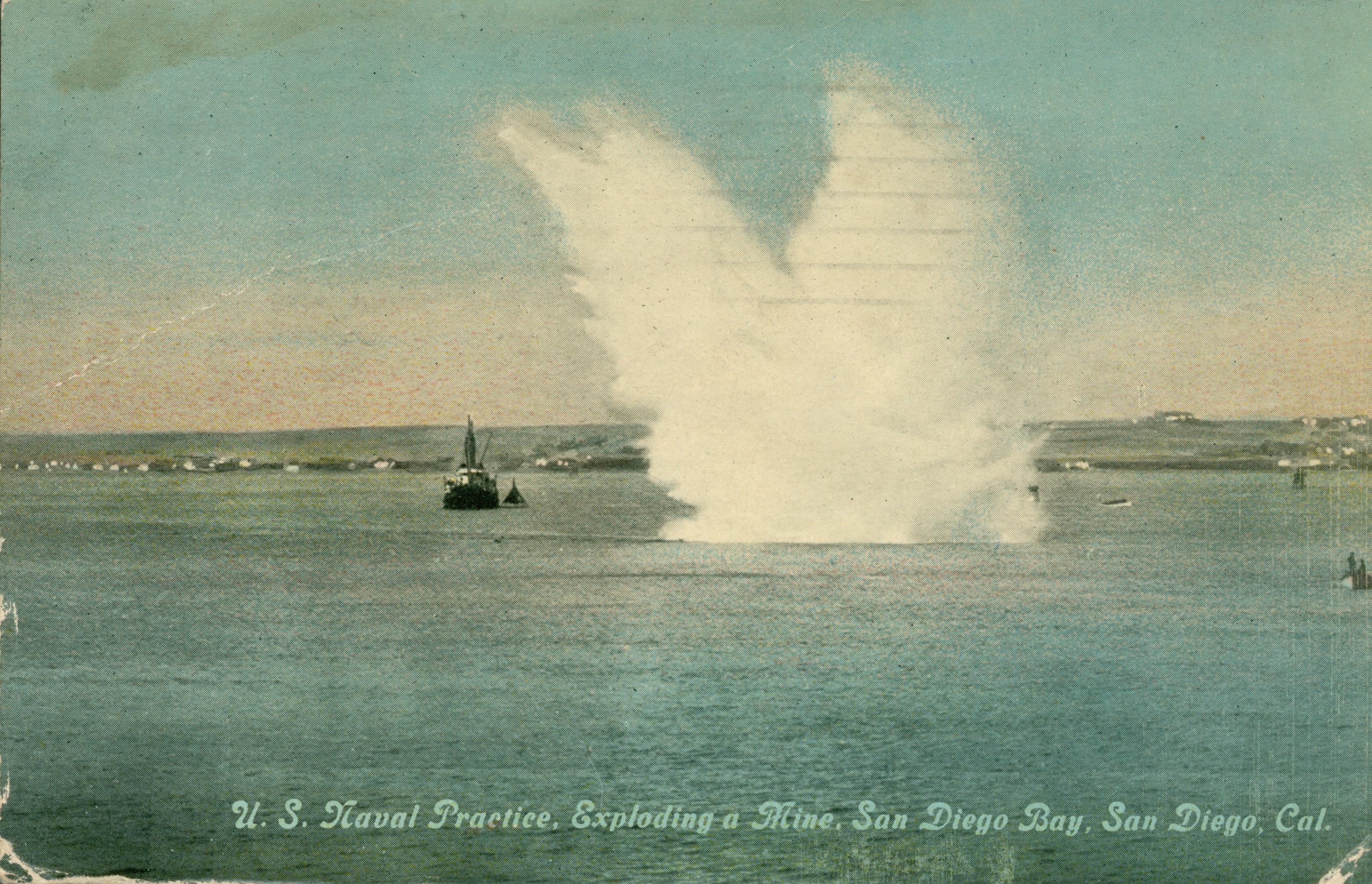 Shows a mine exploding in the bay