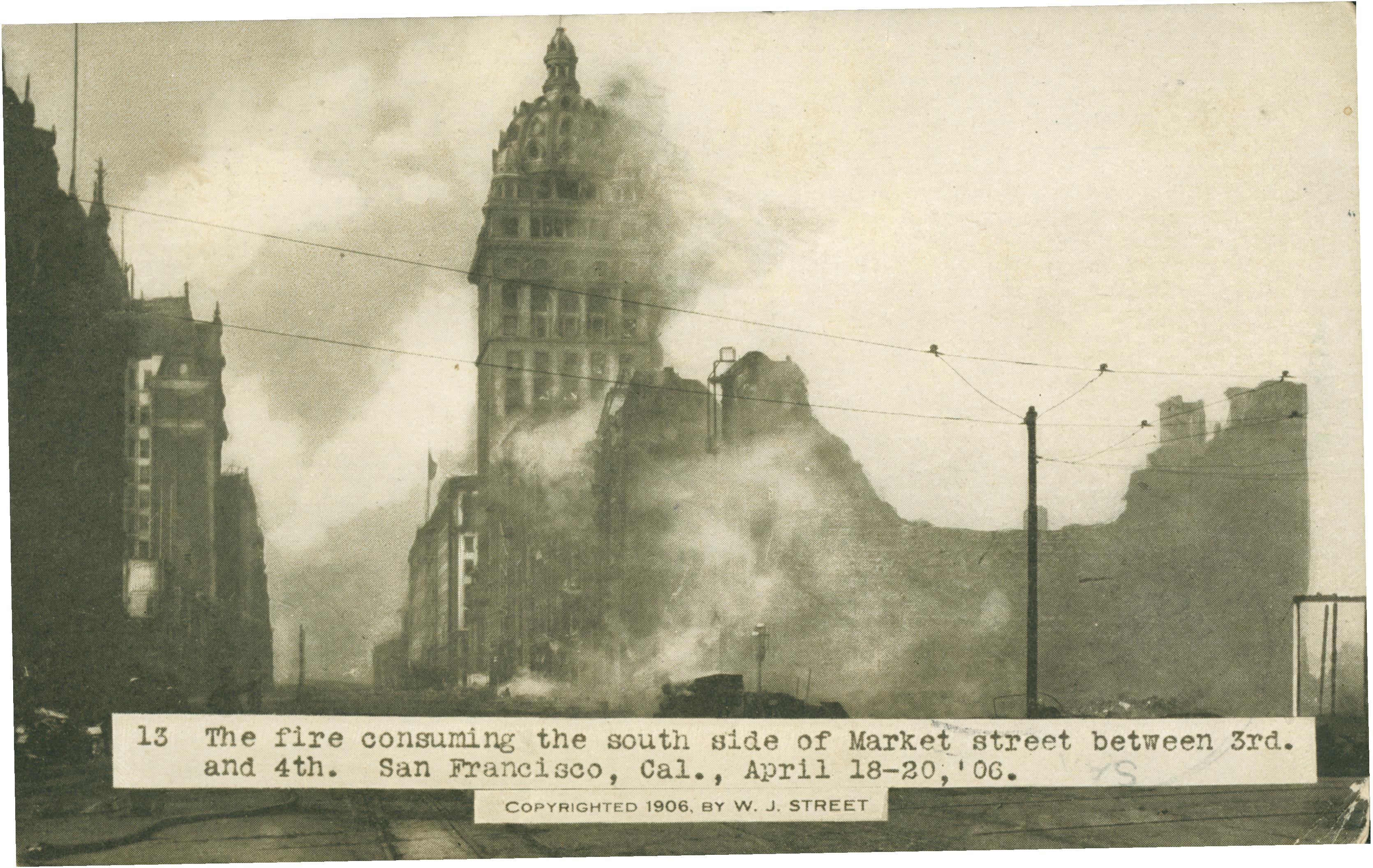 Shows several buildings on fire along Market Street, San Francisco, California.