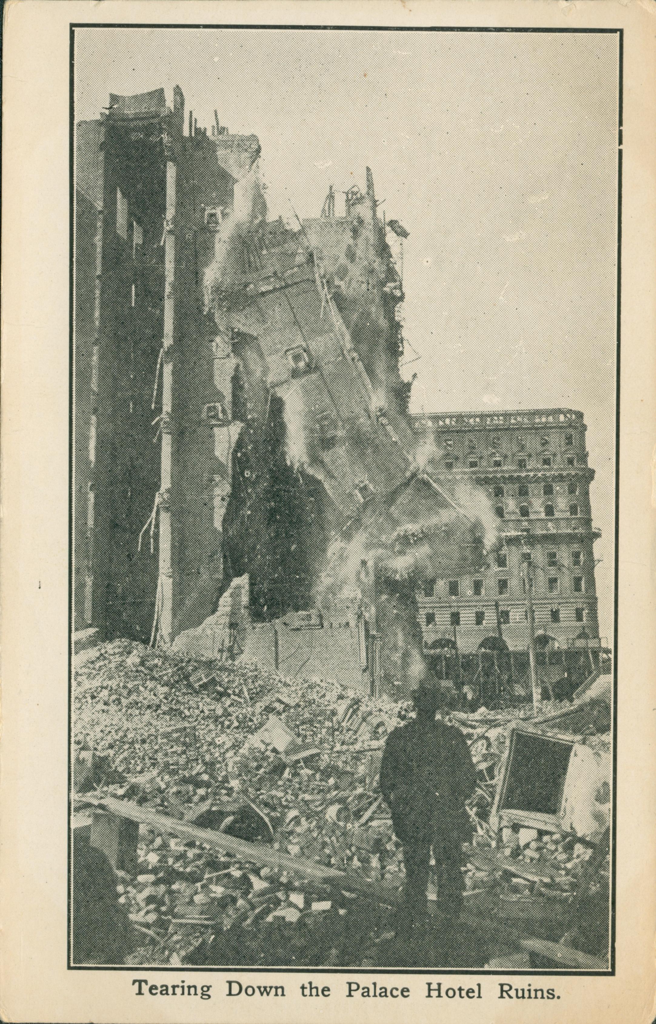 Shows a man watching a building collapsing.