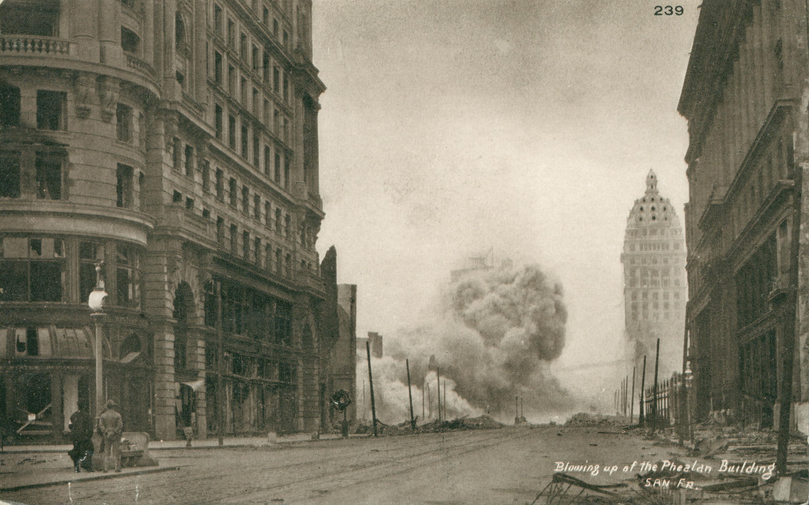 Shows a cloud of dust from the collapse of a building at the end of the street