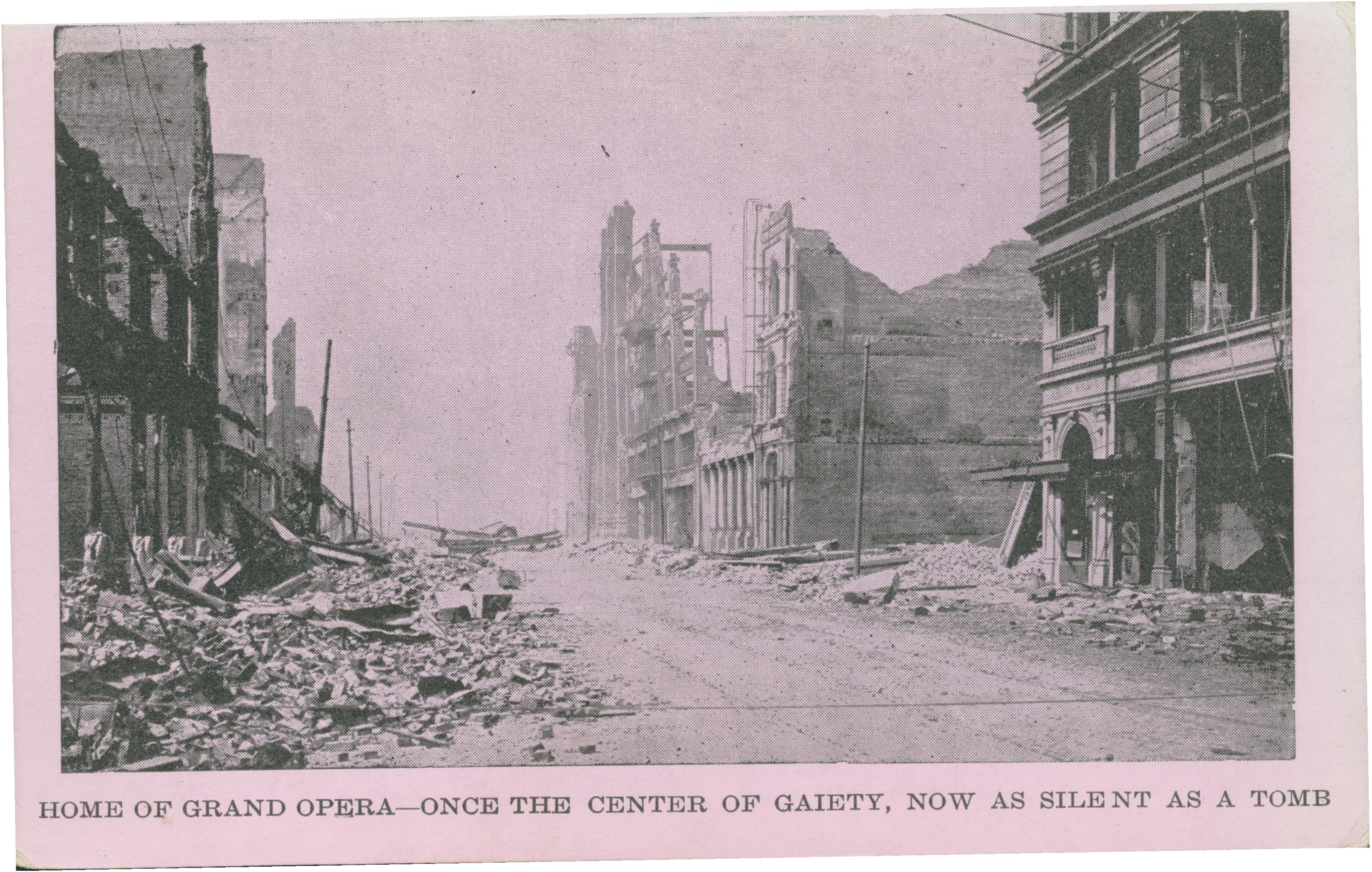 Shows an empty street with ruined buildings on either side.