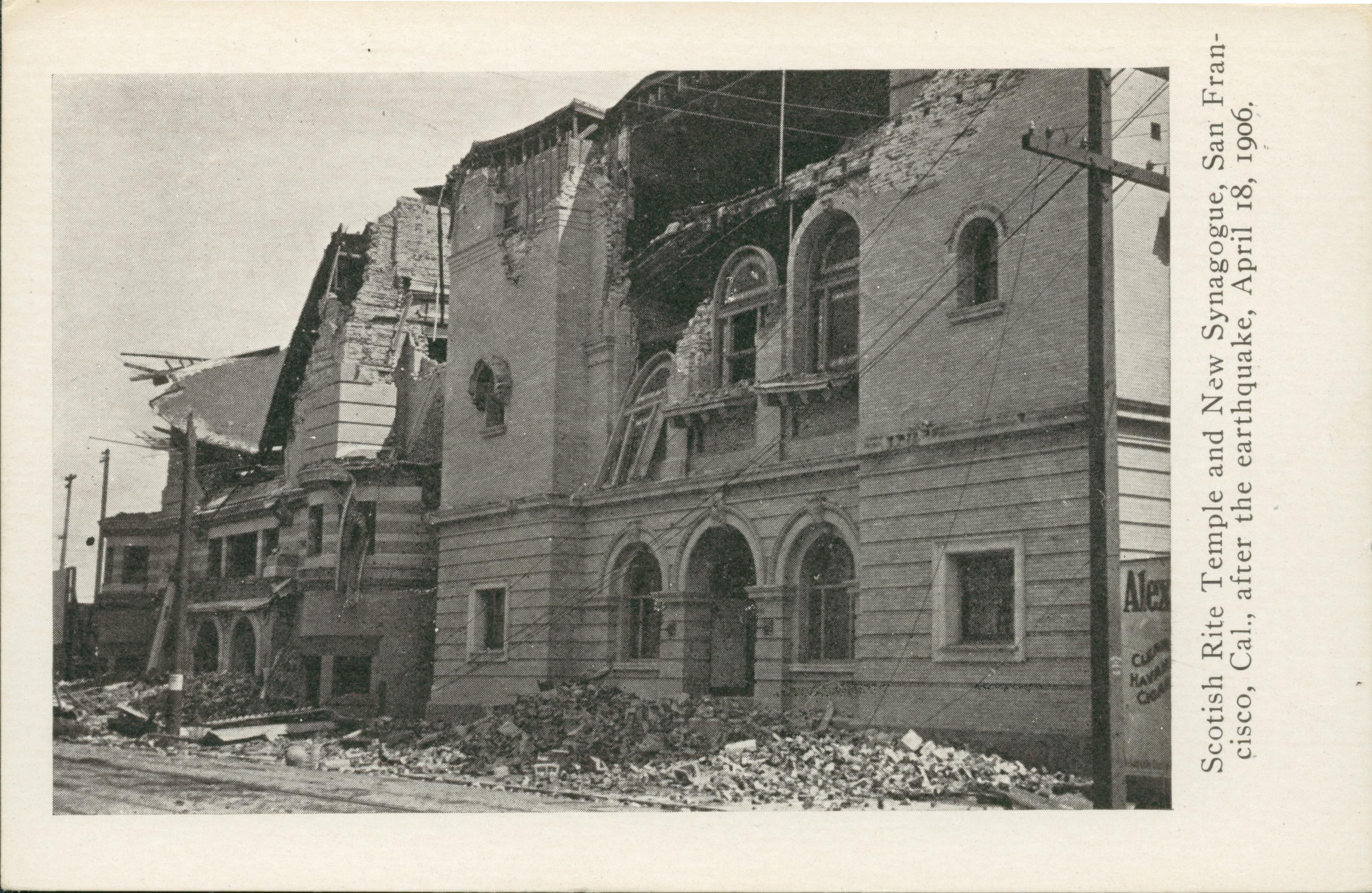 Photo of two damaged buildings with piles of rubble in front.