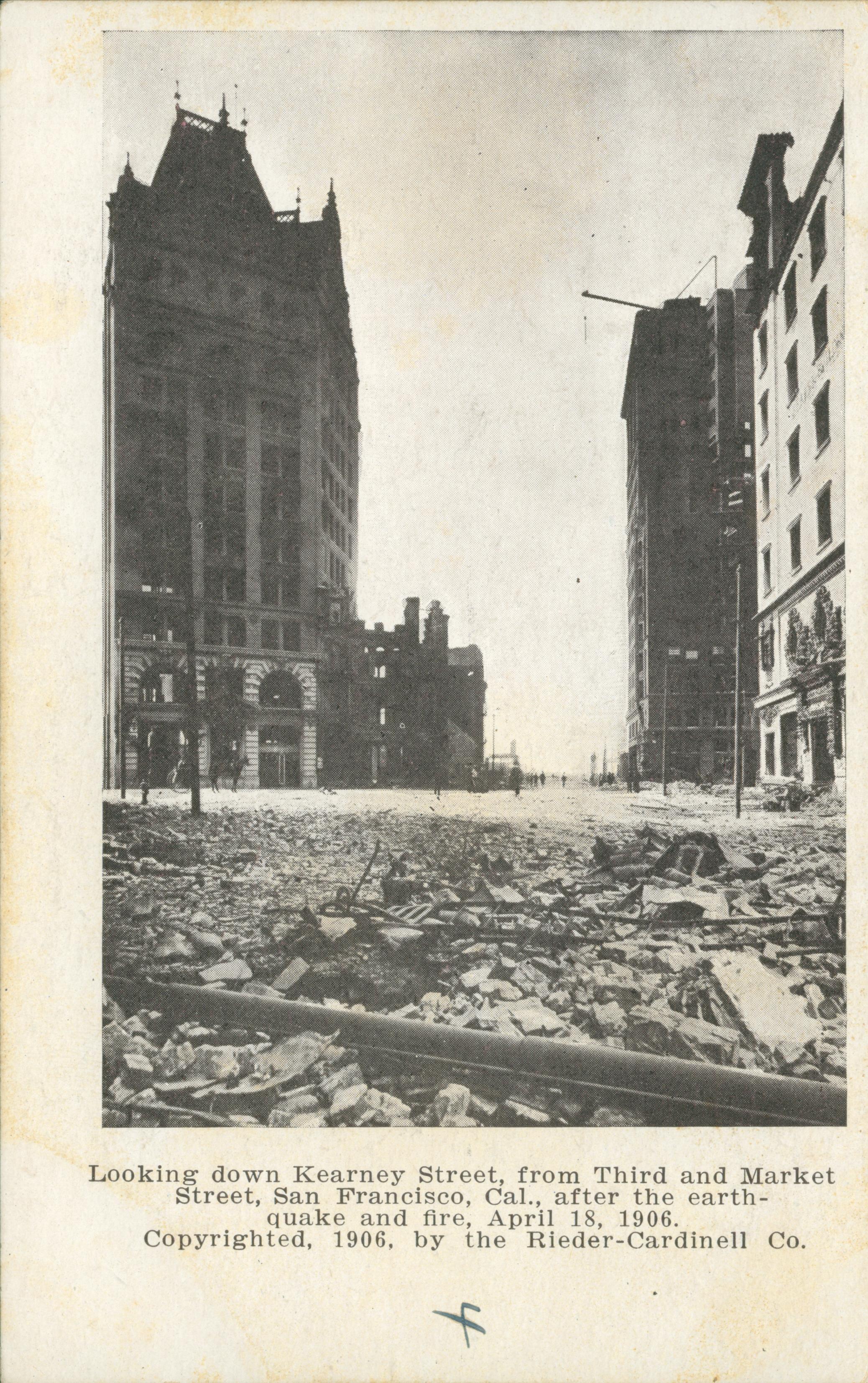 Photo showing Kearney Street covered in rubble from damaged buildings.