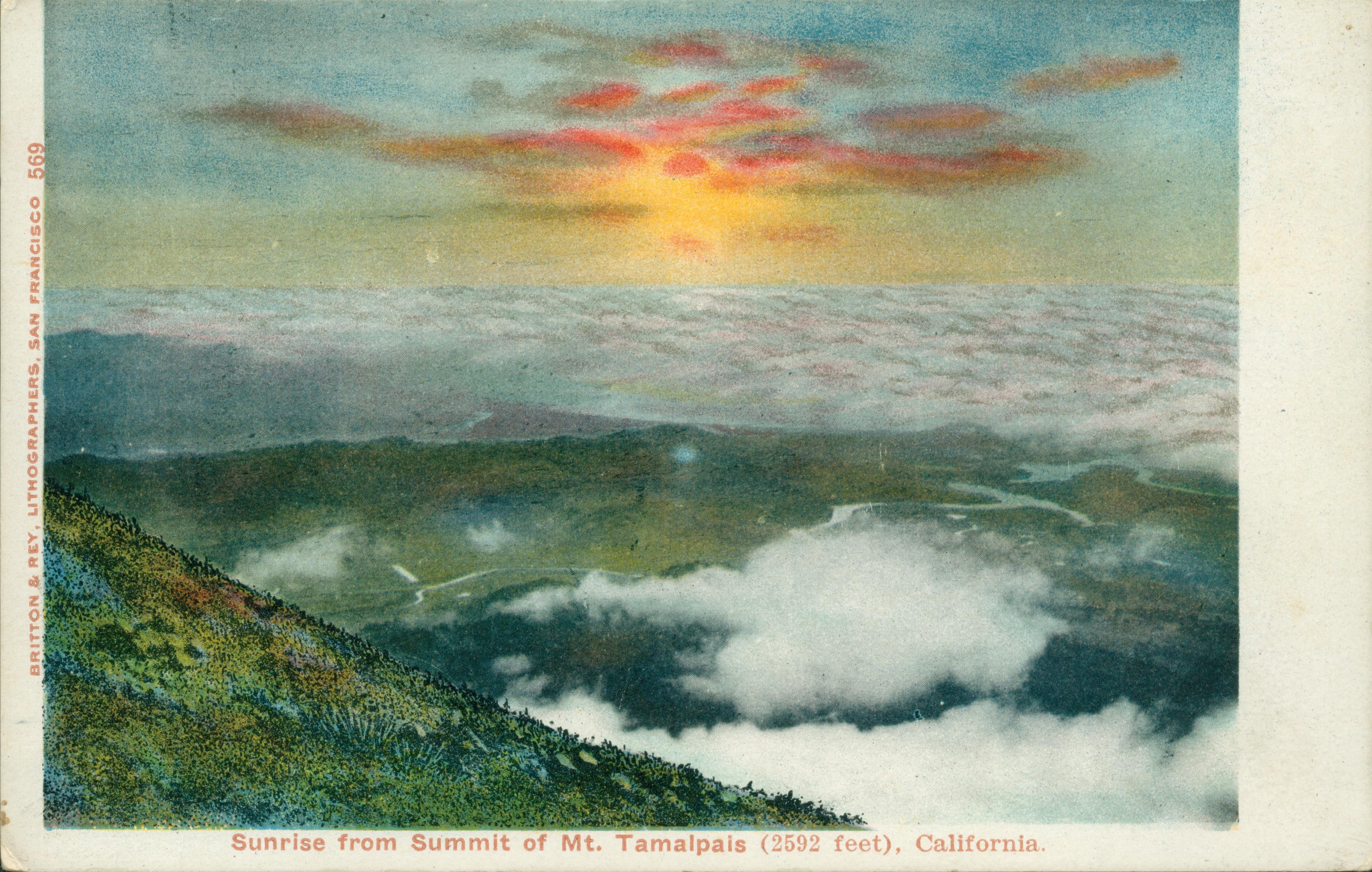 Sunrise view of valley from atop Mt. Tamalpais, California; sunrise, low clouds, rolling green hills below