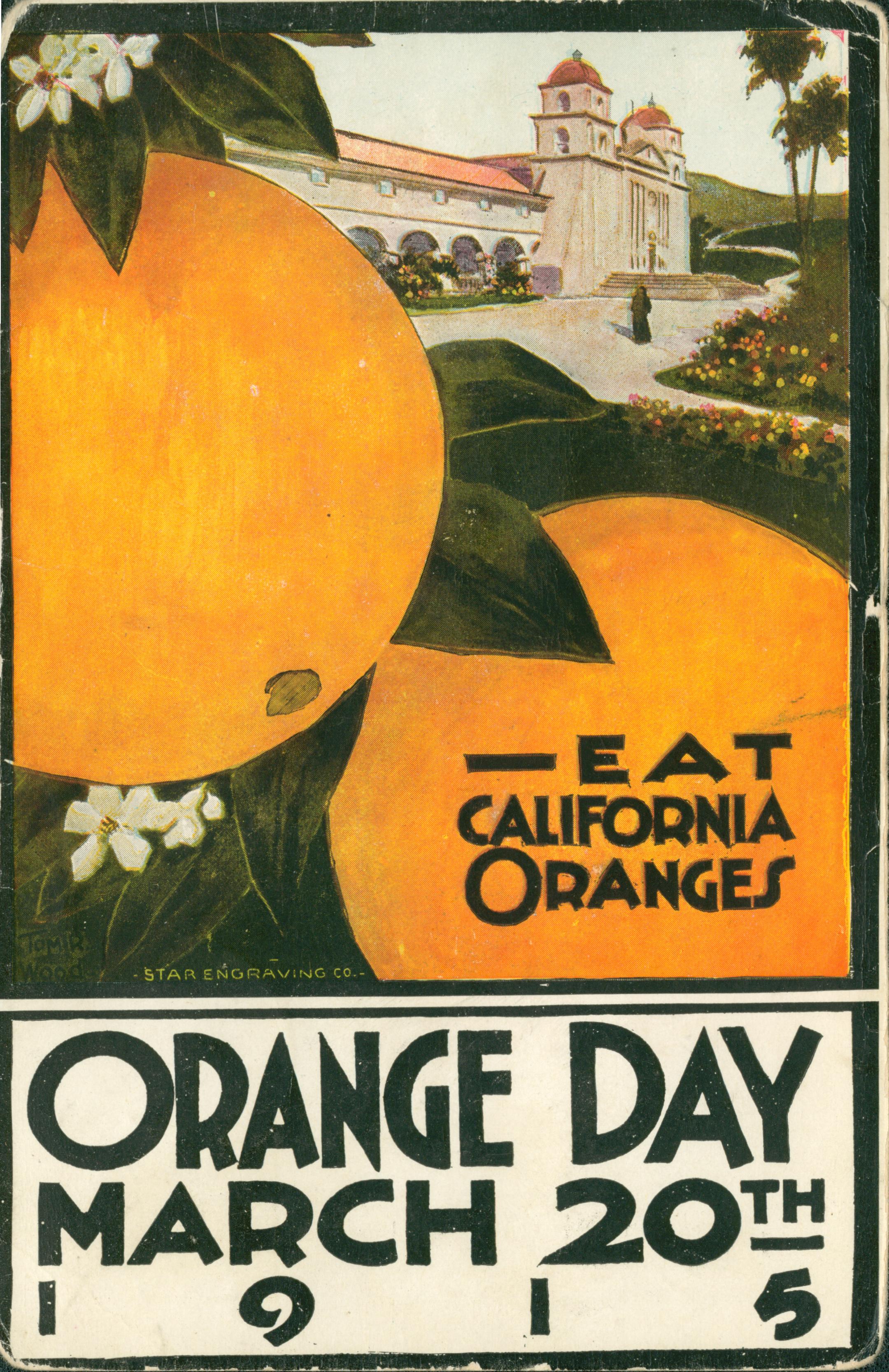 Two large, up-close oranges with leaves and orange flowers, in the background is a large mission-like building with hills, flowers, trees in the background
