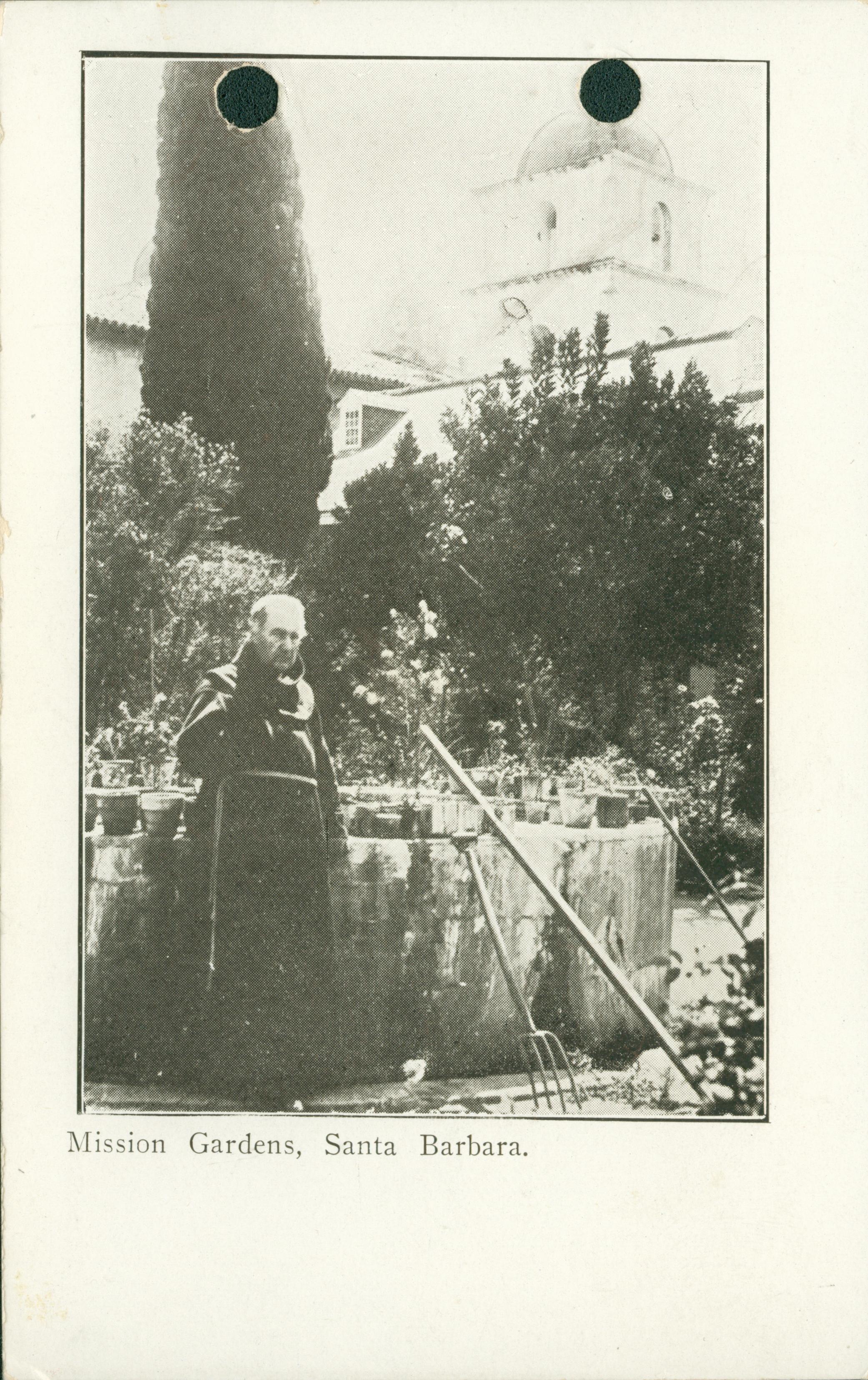 View of the gardens of Mission Santa Barbara, monk working in the garden