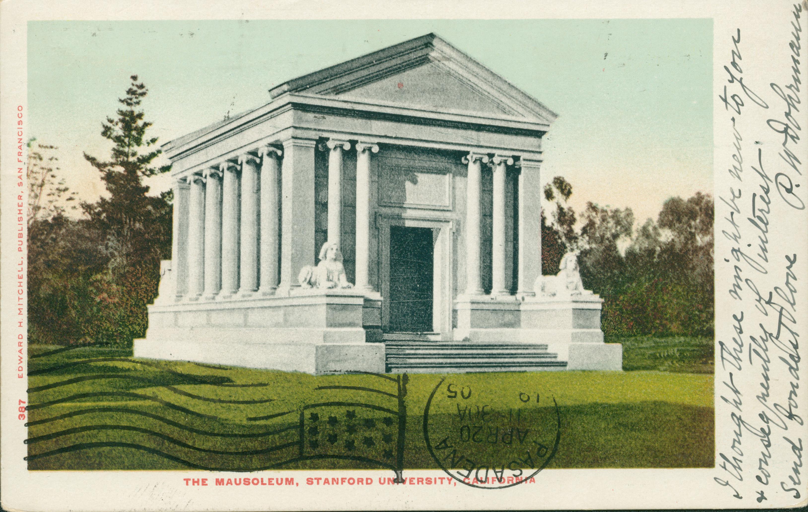View of the large, white Mausoleum at Stanford University, surrounded by  lawn and trees