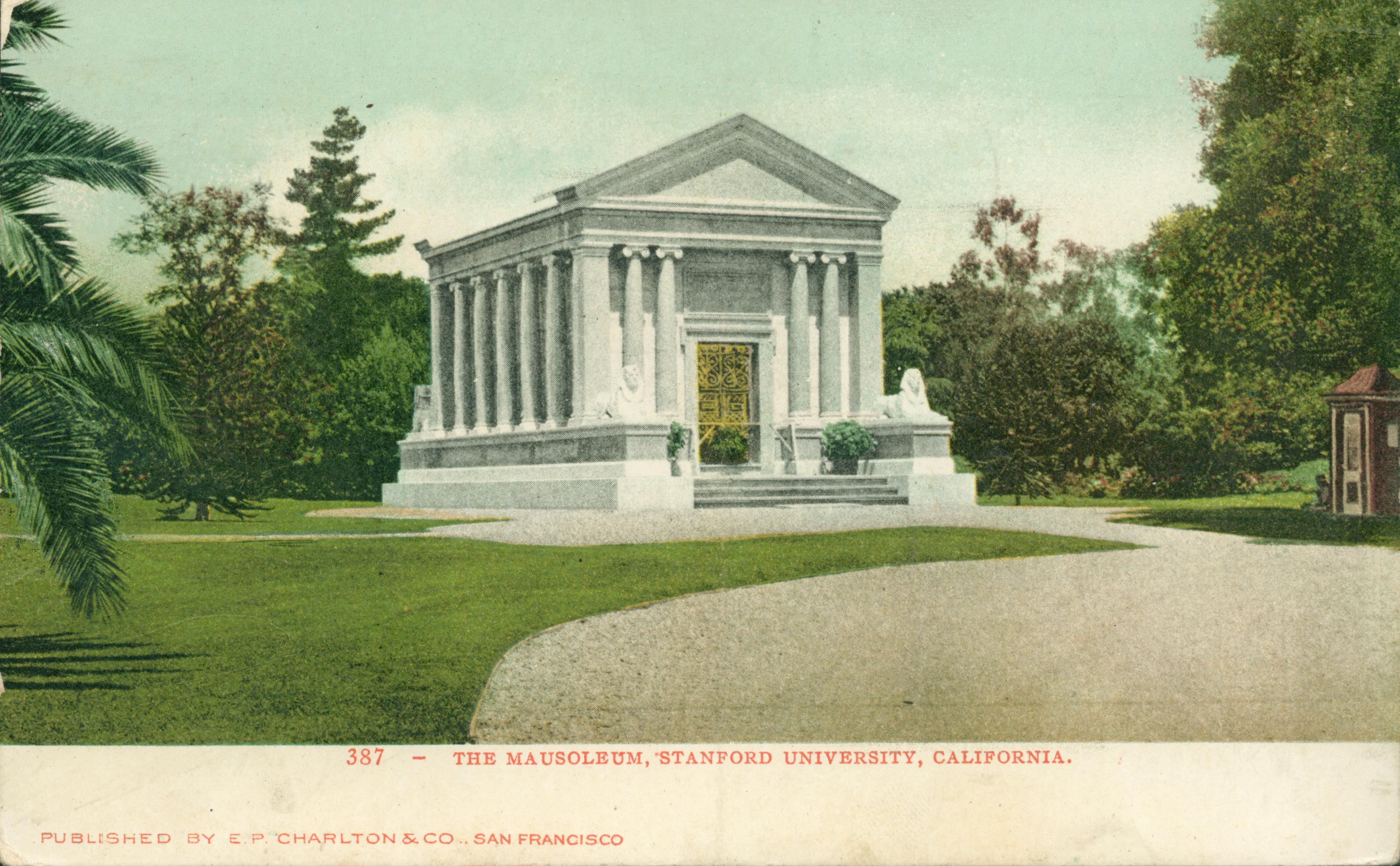 View of the large, white Mausoleum at Stanford University, surrounded by  lawn and trees