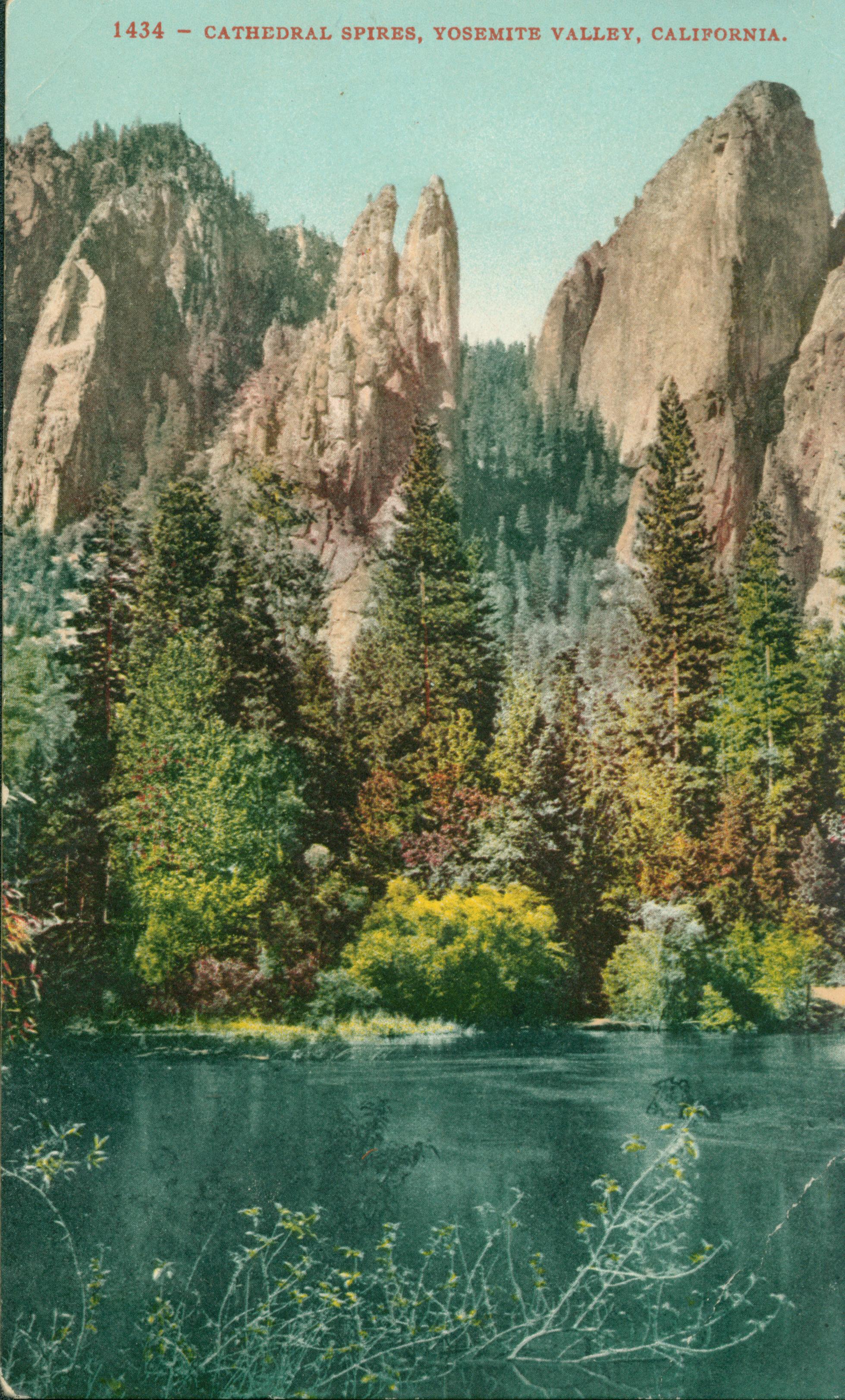 Shows Cathedral Spires with a grove of trees and a body of water in the foreground