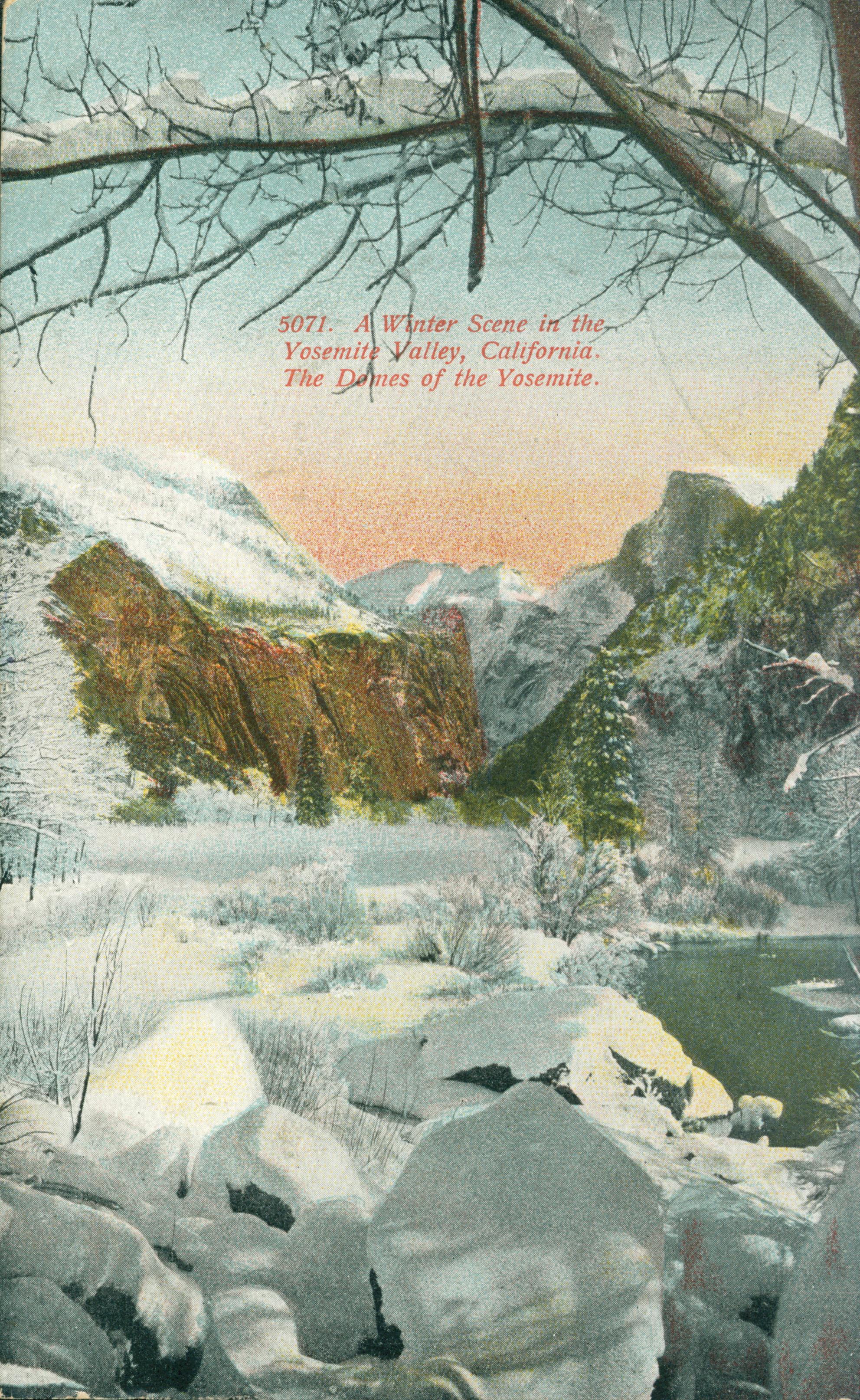 Shows a tree framed image of Yosemite Valley covered in snow with Half Dome and other rock formations in the background