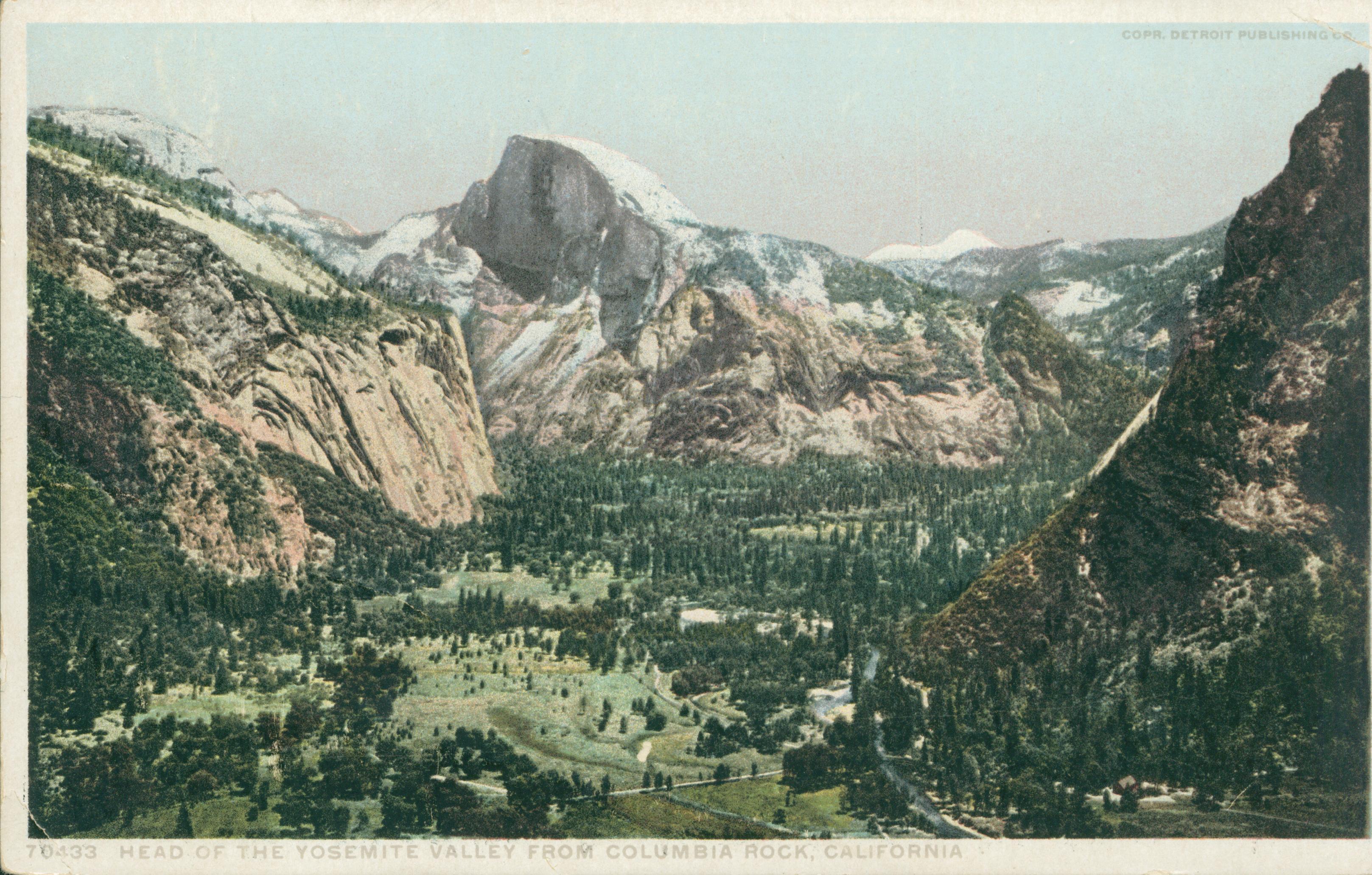 Shows a mountaintop view of Yosemite Valley with Half Dome in the center.