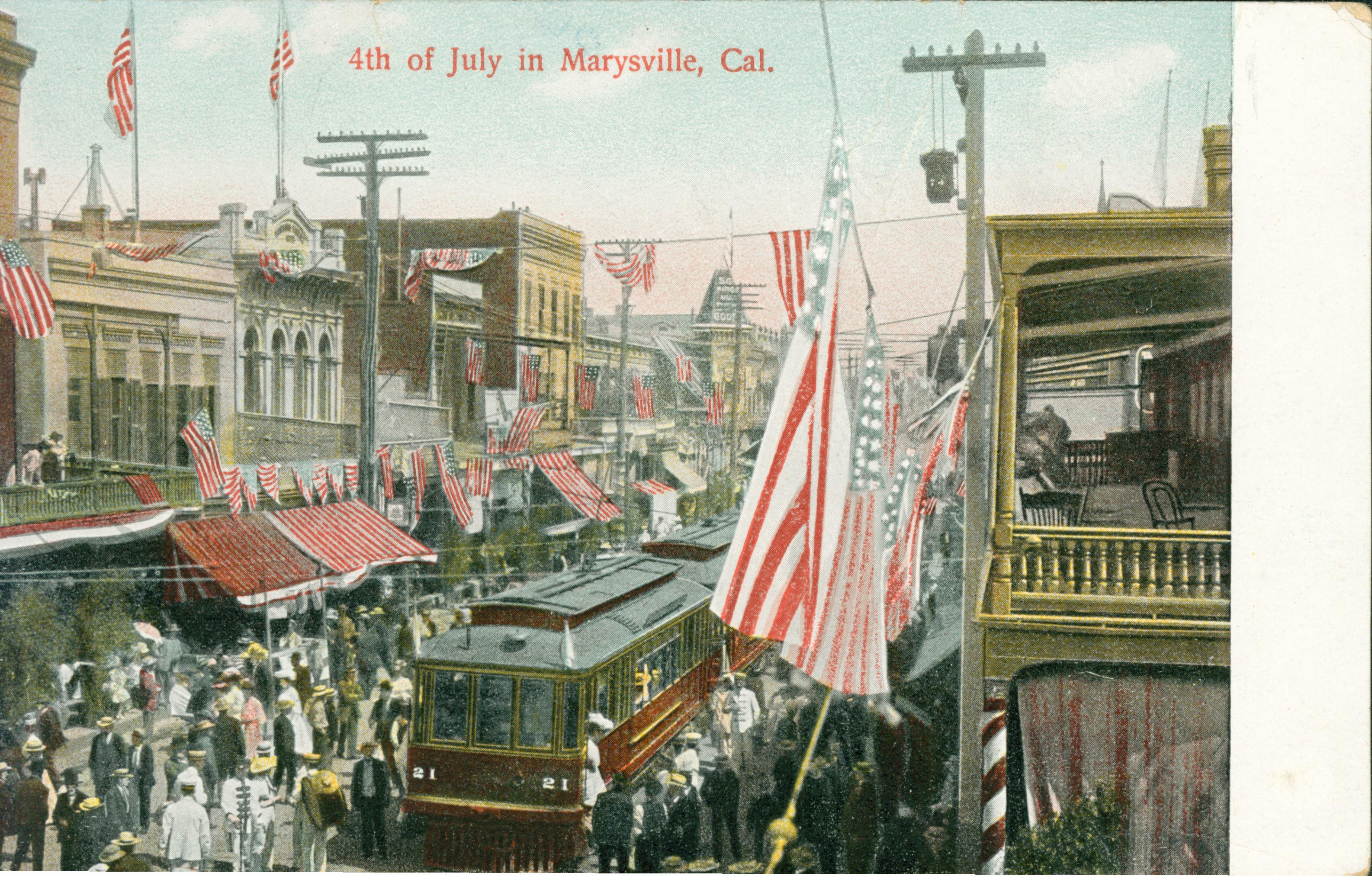 Shows a crowd of people complete with what looks like a band in a Marysville street surrounding a streetcar