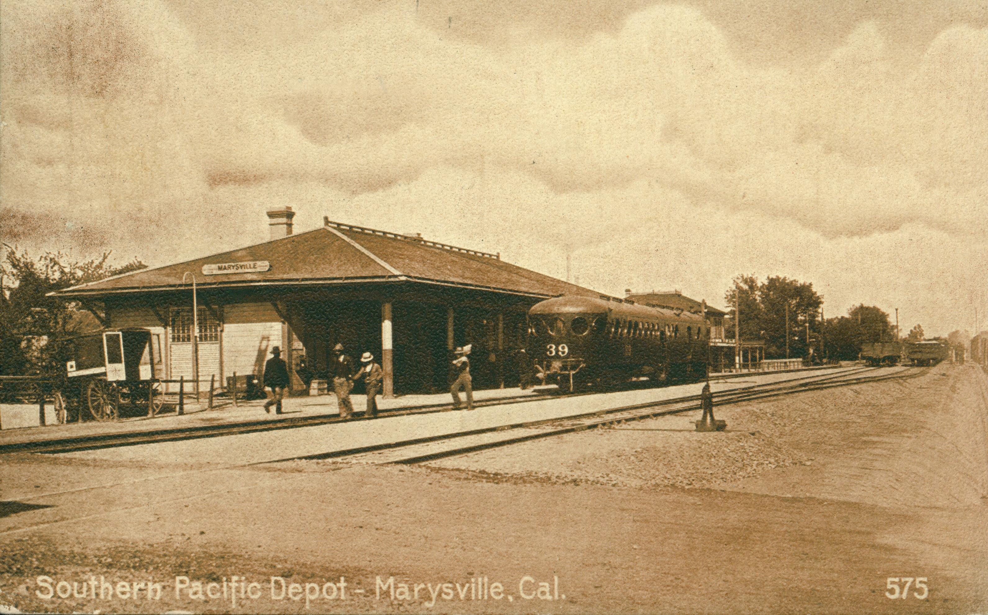 Shows a train pulling into the Marysville Southern Pacific Train Station