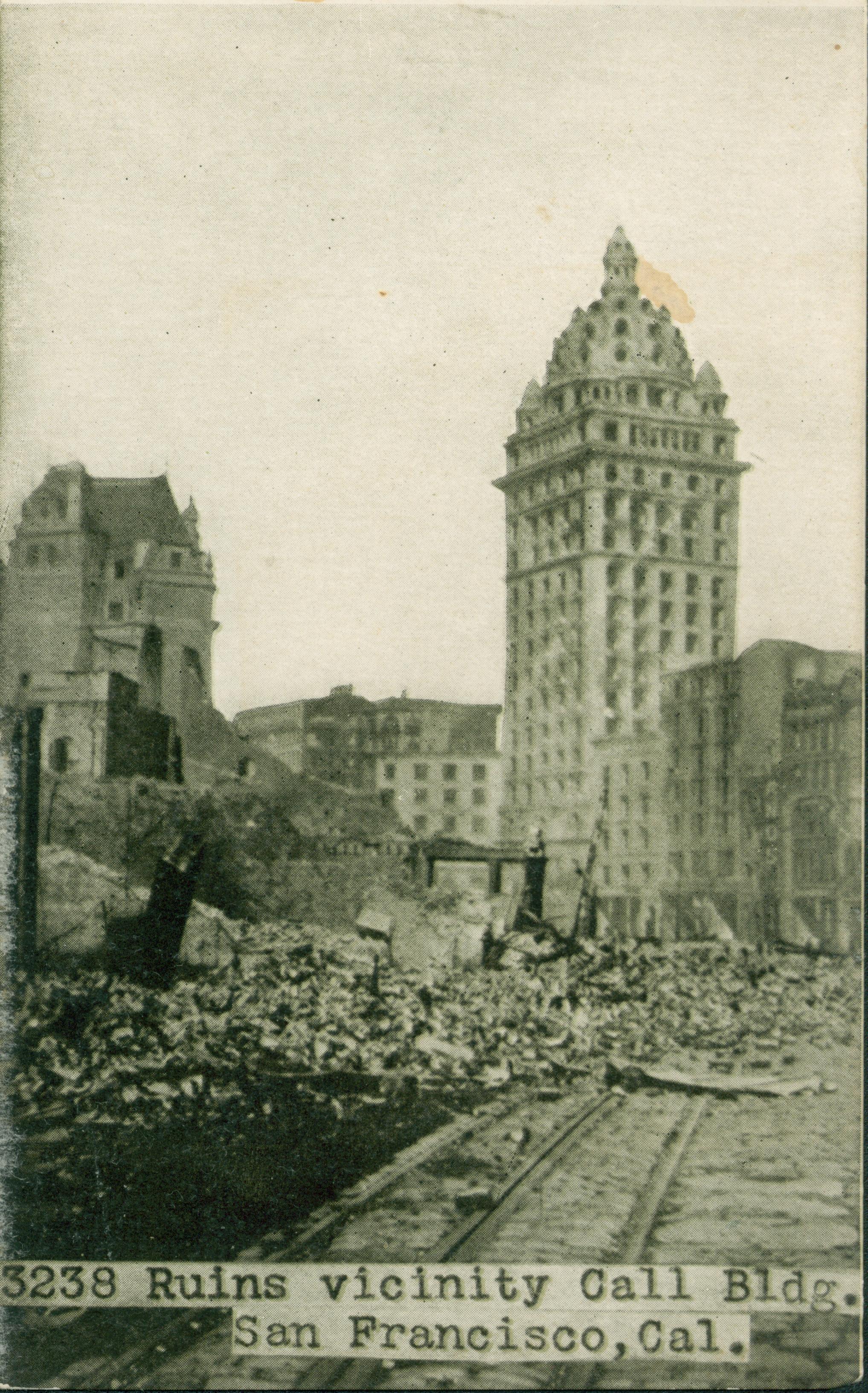 Shows a view of the ruins of the San Francisco Call Building, along with several other buildings