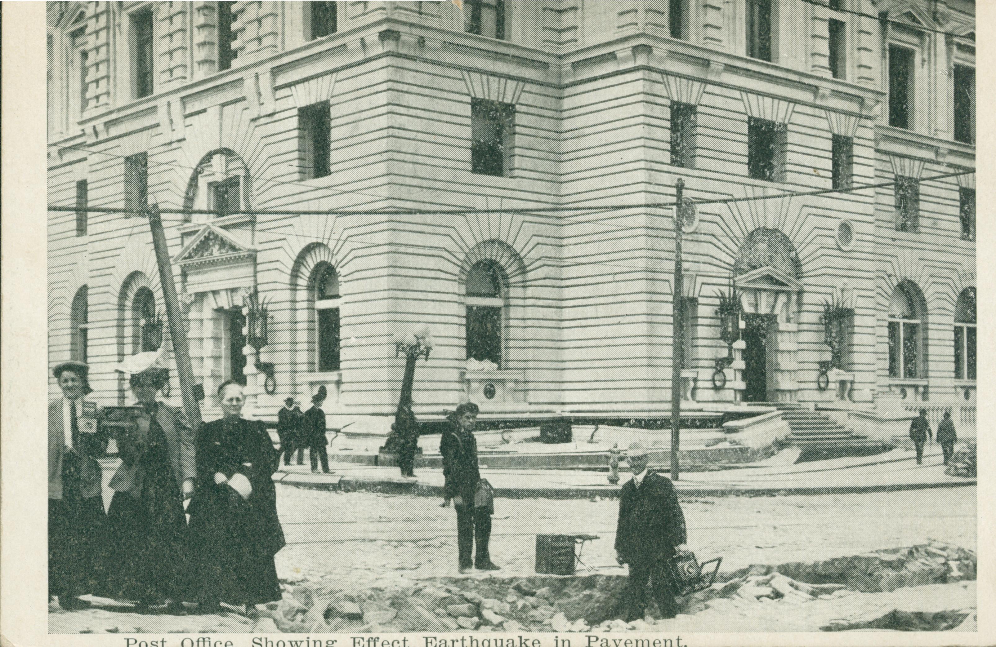 Shows the San Francisco Post office and ruptures in the pavement from the Earthquake
