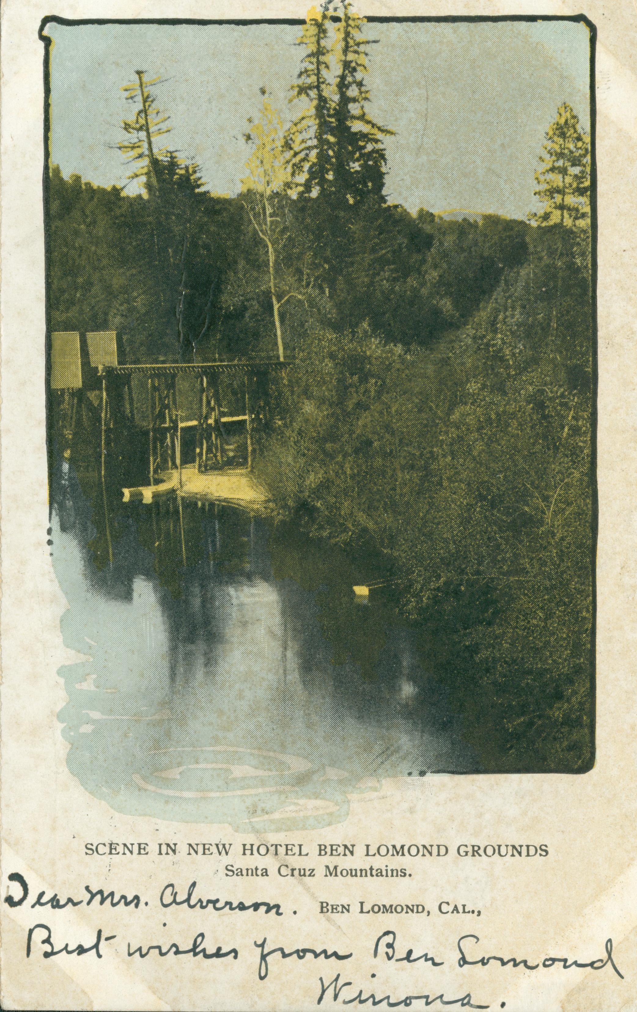 Shows a railroad trestle extending over a pond
