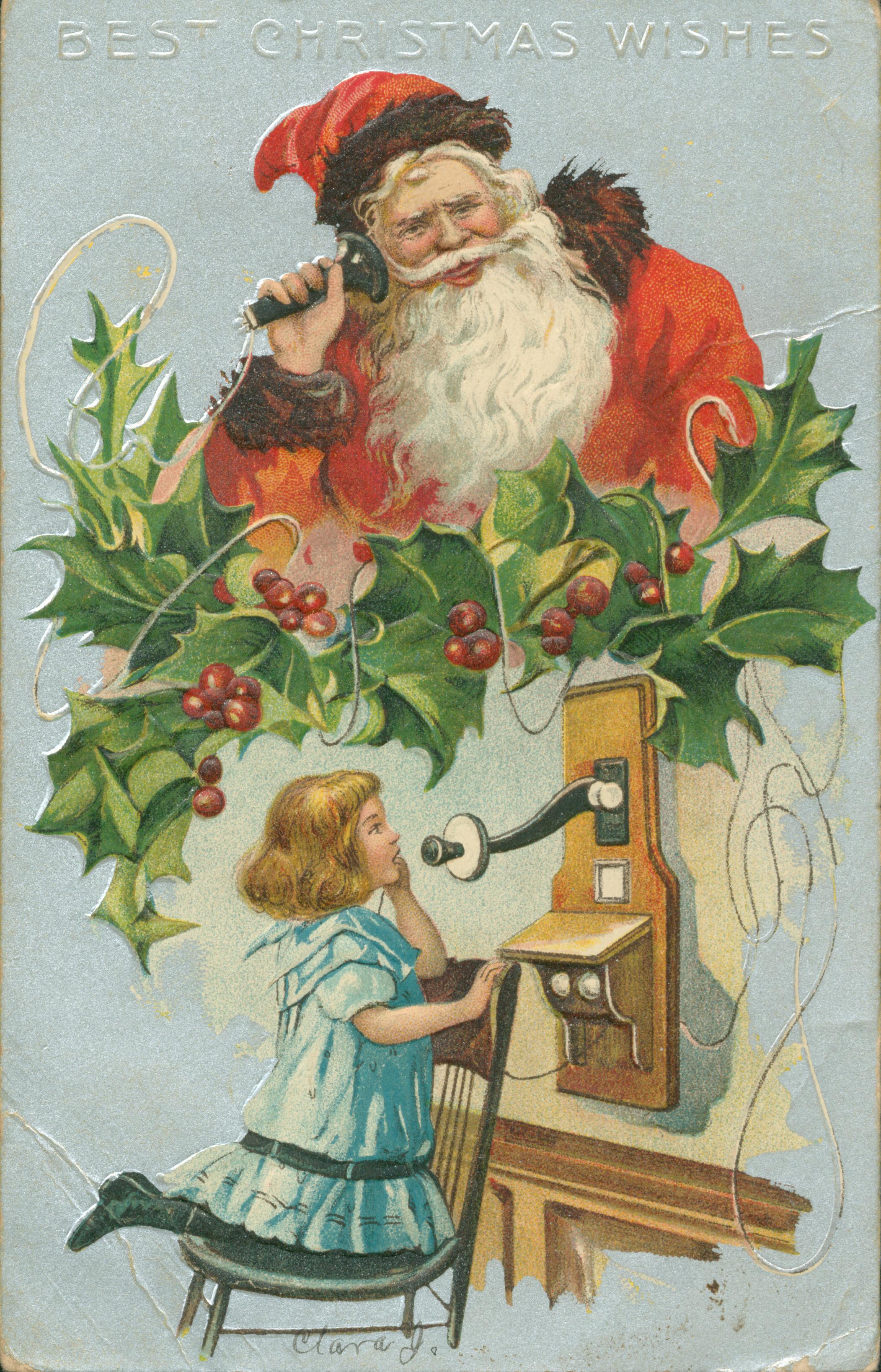 Shows a child making a phone call to Santa