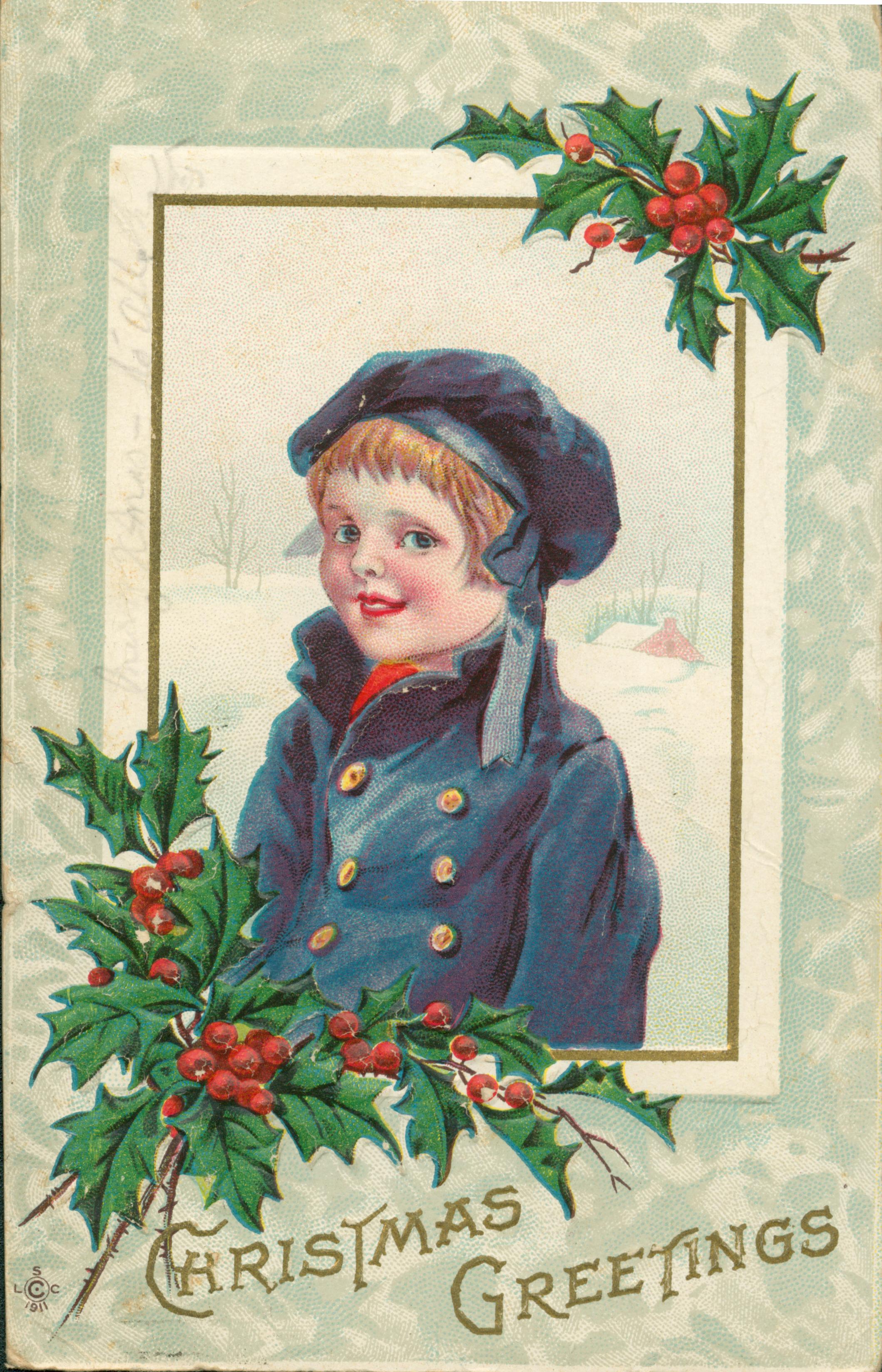 Shows a boy in a snowy scene framed by holly